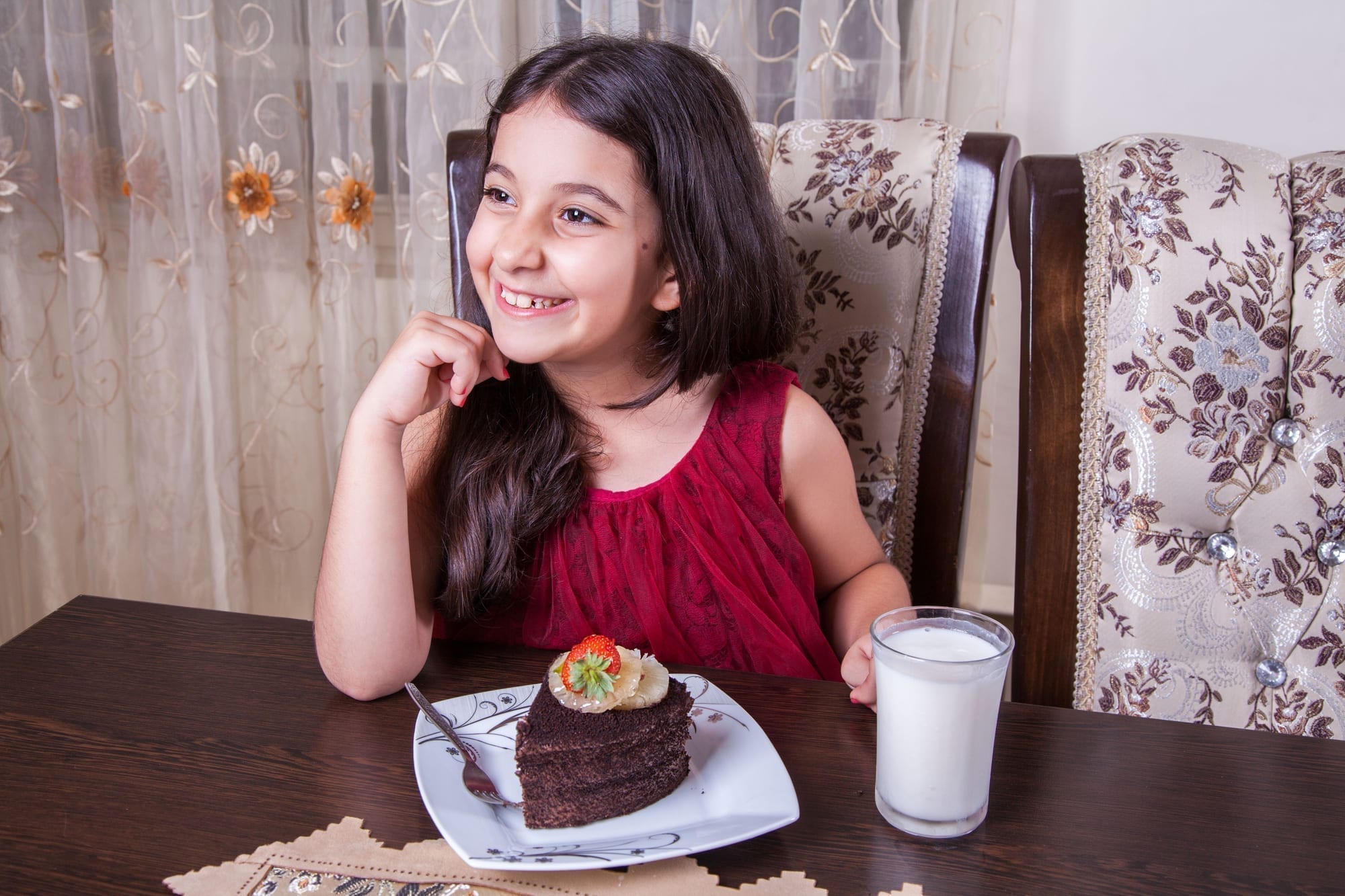 little girl with chocolate cake